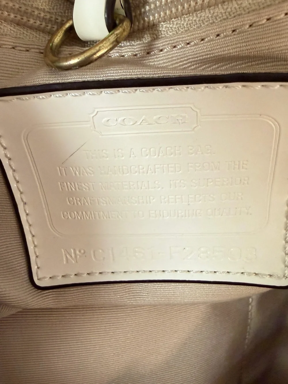 Coach Signature Canvas Beige Tote Bag with Ivory Trim handles are cracked!